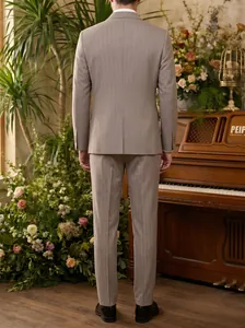 Back view of a premium grey pinstripe business suit set for men in a floral setting