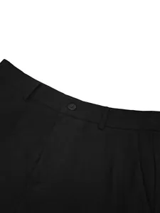 Close-up detail of black formal business suit trousers with button and belt loops.