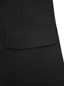 Close-up of black business suit blazer pocket detail and twill fabric texture.