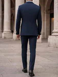 Rear view of a premium slim fit navy blue men's suit set featuring gold buttons
