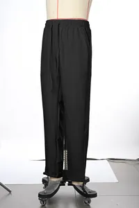 Men's solid black casual straight-leg drawstring trousers on mannequin display