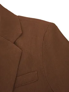 Detail shot of brown professional business suit jacket showing fabric texture and lapel.