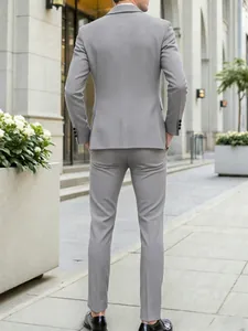 Back view of a slim-fit grey men's formal suit for business and wedding occasions