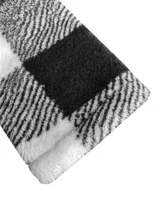 Close-up detail of the soft black and white buffalo plaid plush fabric for men's winter coat