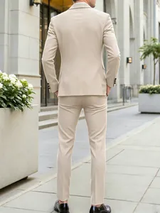 Back view detail of a slim-fit beige men's business suit set for weddings and events