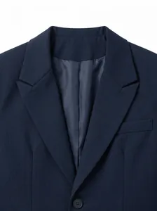 Close-up view of navy blue men's business suit lapel showing fabric texture and finish