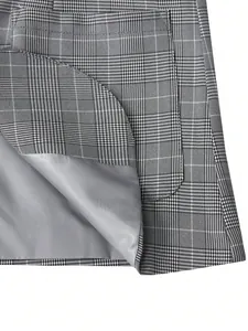 Detailed macro shot of men's plaid blazer showing smooth grey lining and pocket
