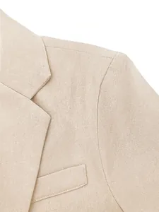 Close-up detail of a beige men's business suit jacket lapel and shoulder texture