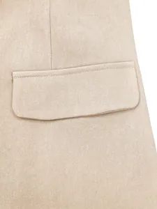 Detail shot of a light beige business suit jacket showing fabric texture and pocket.