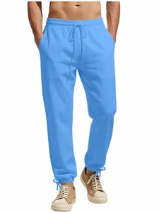 Mens casual light blue drawstring sweatpants with loose straight fit on white background