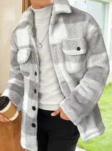 Detailed view of the soft grey and white plaid plush fabric and black buttons on a men's jacket