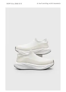 Side view of stacked white flyknit sock sneakers featuring comfortable thick soles.