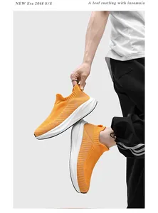 Side detail of orange flying woven sock sneakers with comfortable thick white soles