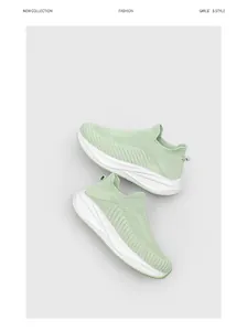 Close-up detail view of mint green breathable knitted sock shoes with thick white soles.