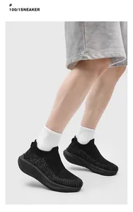 Breathable black fly knit sock sneakers with thick sole and slip-on design for couples