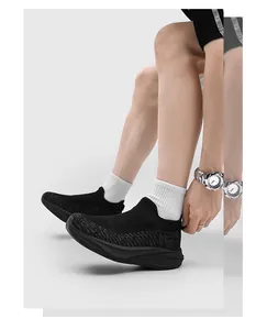 Close-up detail of lightweight black breathable fly-woven sock shoes with shock-absorbing thick sole