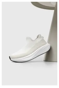 Detailed close-up view of a white breathable flyknit sock shoe featuring a thick sports sole