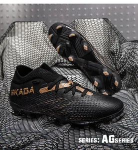 Close-up of seamless flyknit football boots with AG studs for professional training