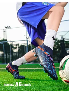 Professional flyknit soccer cleats with AG studs shown in action on a green grass pitch.