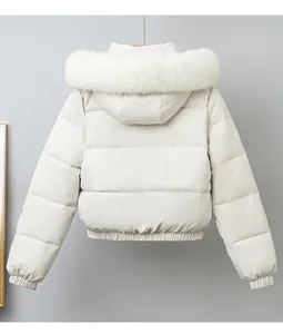 Detailed back view of a white short puffer jacket featuring a luxury large faux fur hood