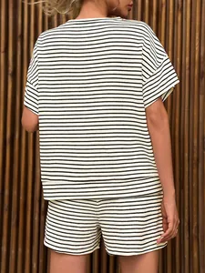 Back view of women's black and white horizontal striped short sleeve T-shirt and shorts set