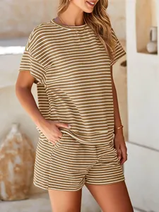 Close-up detail of women's casual two-piece striped outfit with short sleeves and shorts