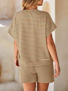 Back view of a woman wearing a brown and white striped casual two-piece shorts set