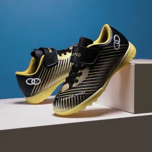 Professional children's turf soccer shoes for outdoor training in black and yellow