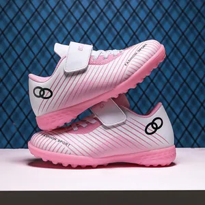 Pink and white children's turf soccer shoes with non-slip studs for outdoor training