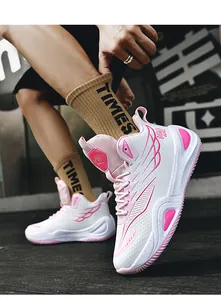 Detailed view of high-top pink and white basketball shoes with wing pattern design