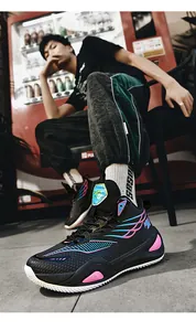 Detailed view of high-top mismatched basketball shoes with blue and pink wave design
