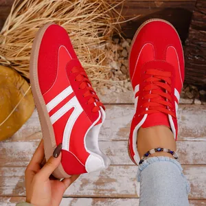 Vibrant red retro casual sneakers with white stripes and gum sole for women's daily wear