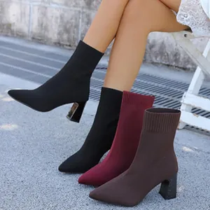 Stylish pointed-toe knit sock boots with comfortable block heels in multiple colors.