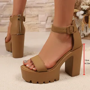 Detail view of chunky platform sandals featuring a 12cm heel height and ankle strap.