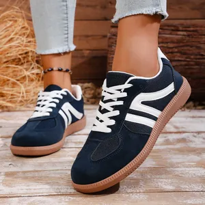 Navy blue vintage sneakers for women with flat rubber soles for casual everyday wear