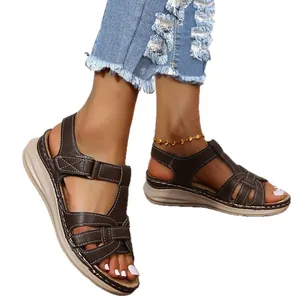 Elegant womens vintage Roman sandals with a thick wedge sole and cross strap stitching