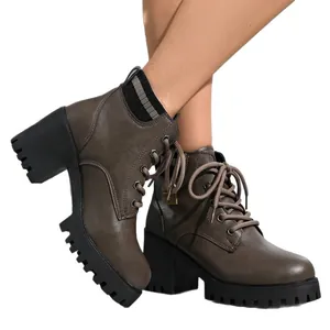 Women's brown lace-up heeled Martin boots with chunky black sole and knit collar