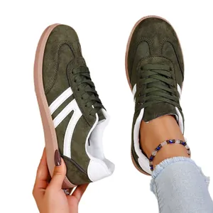 Stylish green women's German Army Trainer casual sneakers with classic gum sole