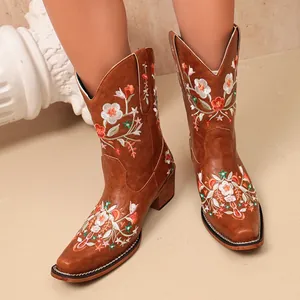 Women's elegant tan embroidered cowboy boots featuring vintage floral patterns and heels