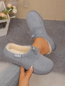 Detailed view of gray faux suede clogs featuring warm plush lining and adjustable cord