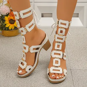 Stylish white gladiator sandals featuring gold metal links and comfortable chunky heels