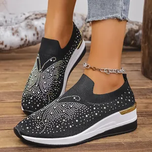Elegant black knit wedge sneakers with sparkle rhinestone butterfly on thick platform
