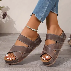 Stylish women's casual platform sandals featuring brown cross straps and comfortable wedge sole