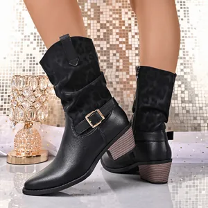 Detail view of women's black leather mid-calf boots with leopard print and chunky heel