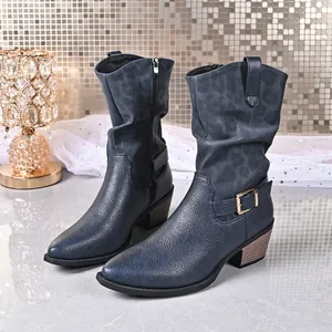 Detail view of blue mid-calf leather boots featuring side zipper and chunky wood-grain heel