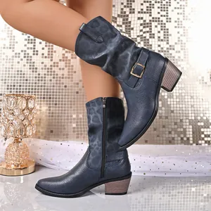 Detail view of blue mid-calf leather Martin boots with chunky heel and side zipper