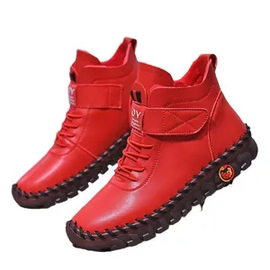 Red women's warm high-top Martin boots with cozy fleece lining and velcro closure