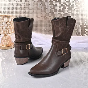Detail view of brown mid-calf boots with leopard print and buckle accent.