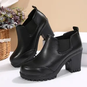 Elegant black chunky heel ankle boots with platform sole and elastic side panels