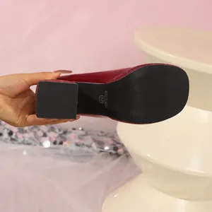 Bottom view of red patent leather Mary Jane platform heel showing non-slip sole detail